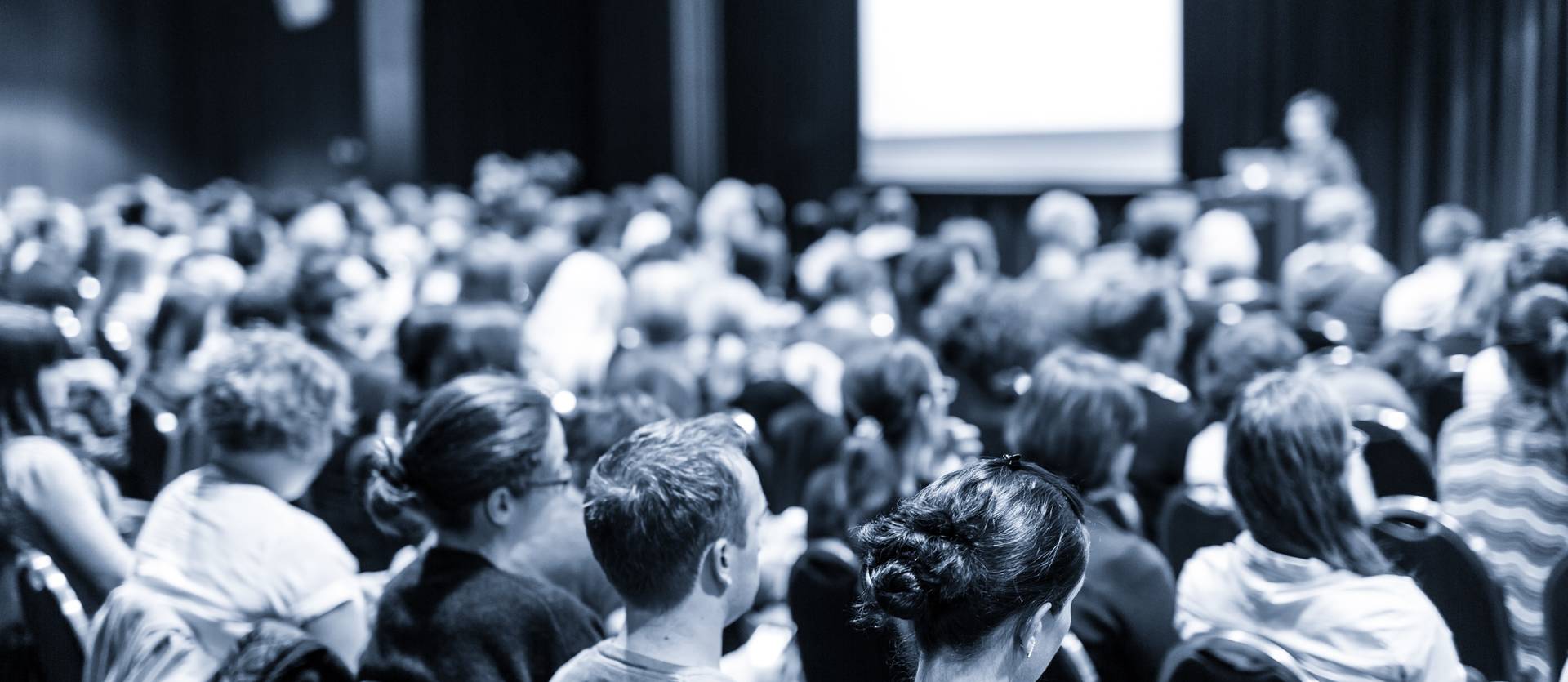 Audience sitting in a conference room