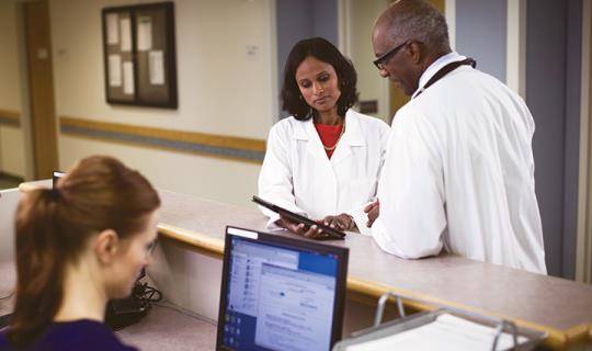 Doctors examining notes